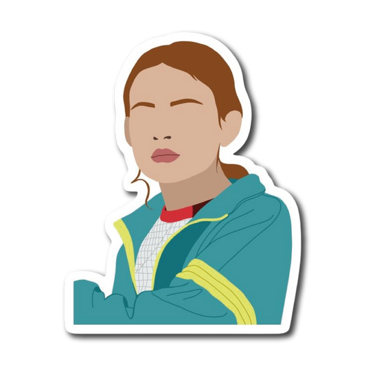 Girl in teal and yellow track jacket with arms crossed