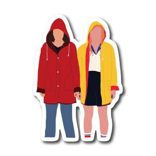 Two girls in red and yellow raincoats holding hands