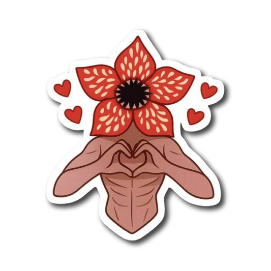 Red flower-headed figure making a heart shape with hands, surrounded by hearts