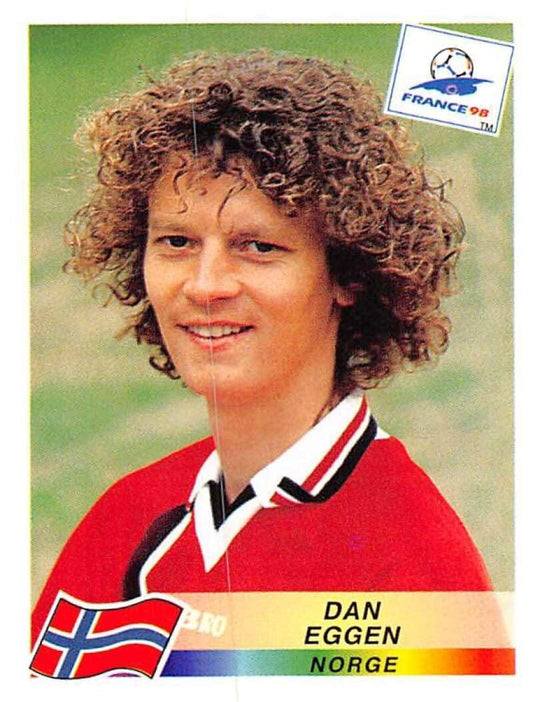 Die-cut sticker reproducing a France 98 World Cup trading card portrait of Norwegian footballer Dan Eggen.